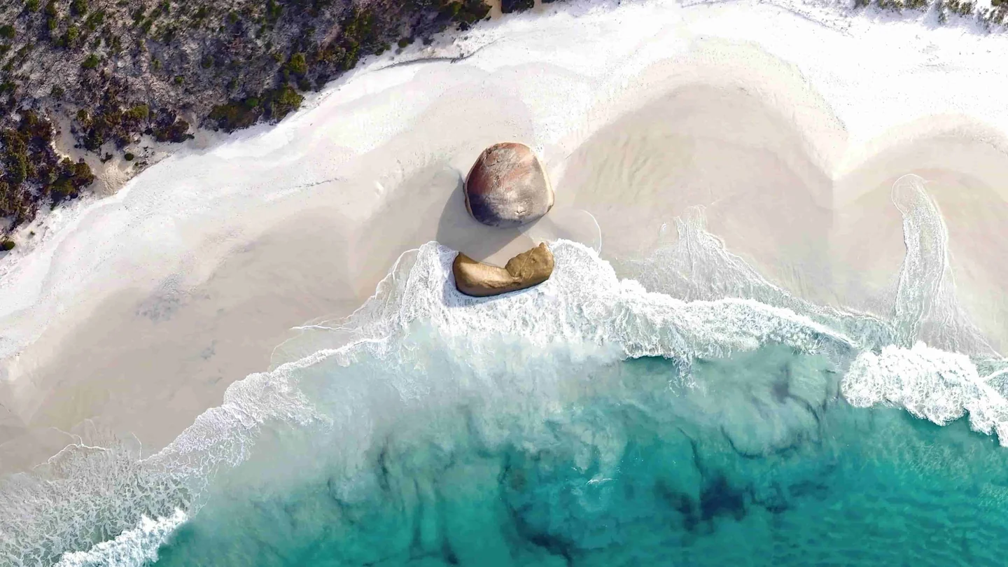 Beach and granite boulders from Tommie’s website hero